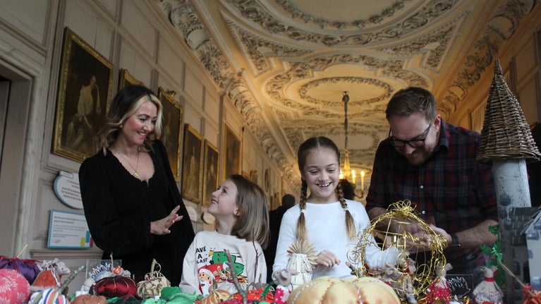 Family enjoying Christmas in Long Gallery